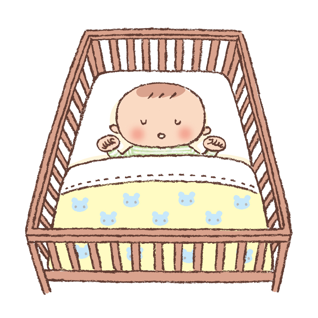 ベビーベッドで寝る赤ちゃん